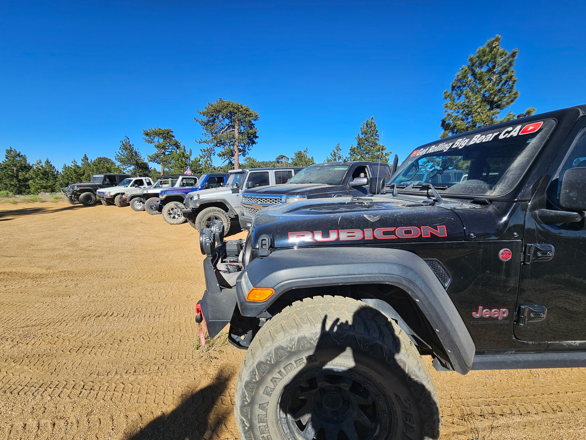 Lineup of off-road rigs on a Get Rolling run